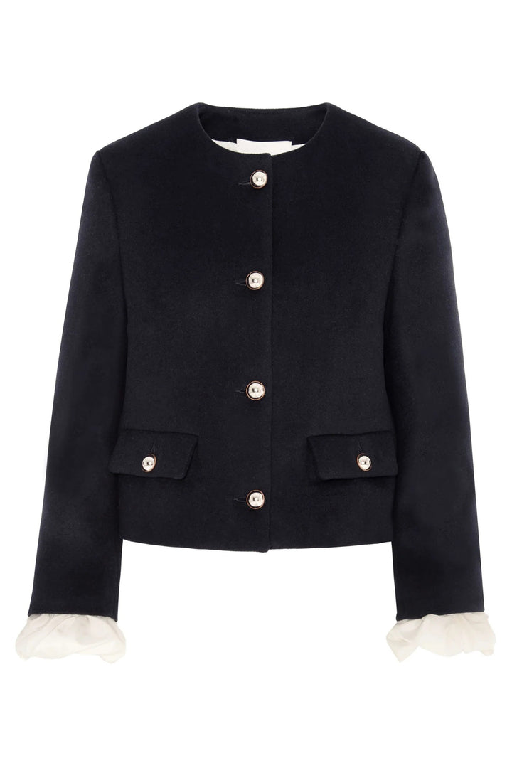 Navy jacket with white buttons and cuffs on a white background
