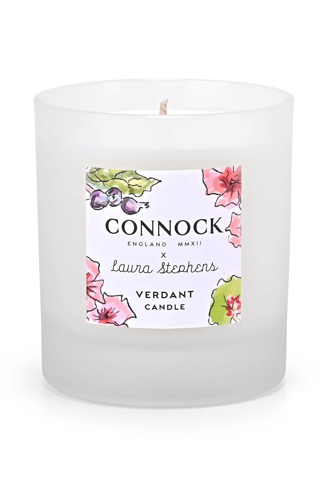 White candle with a floral label on a white background