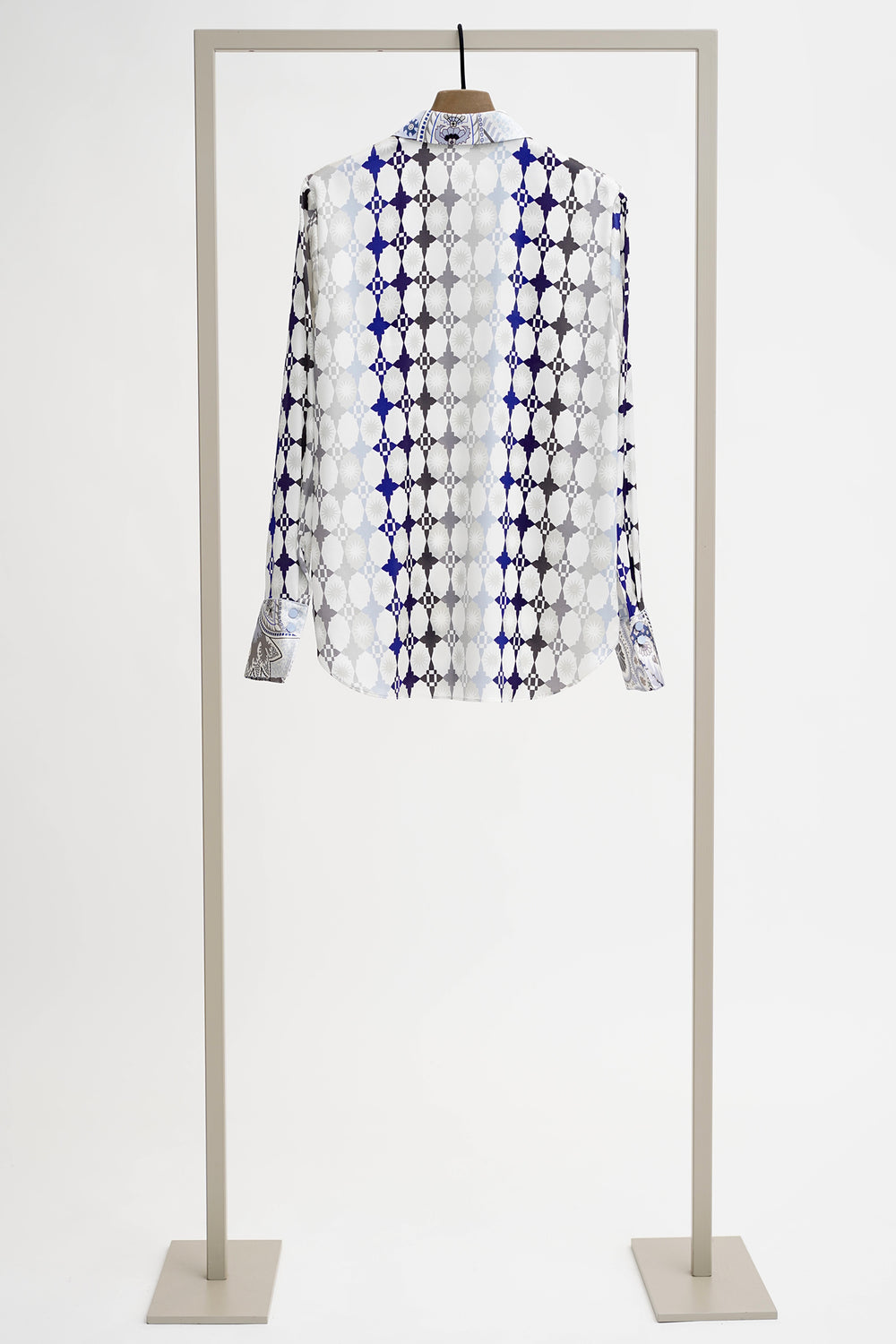 Patterned shirt on a mannequin against a white background