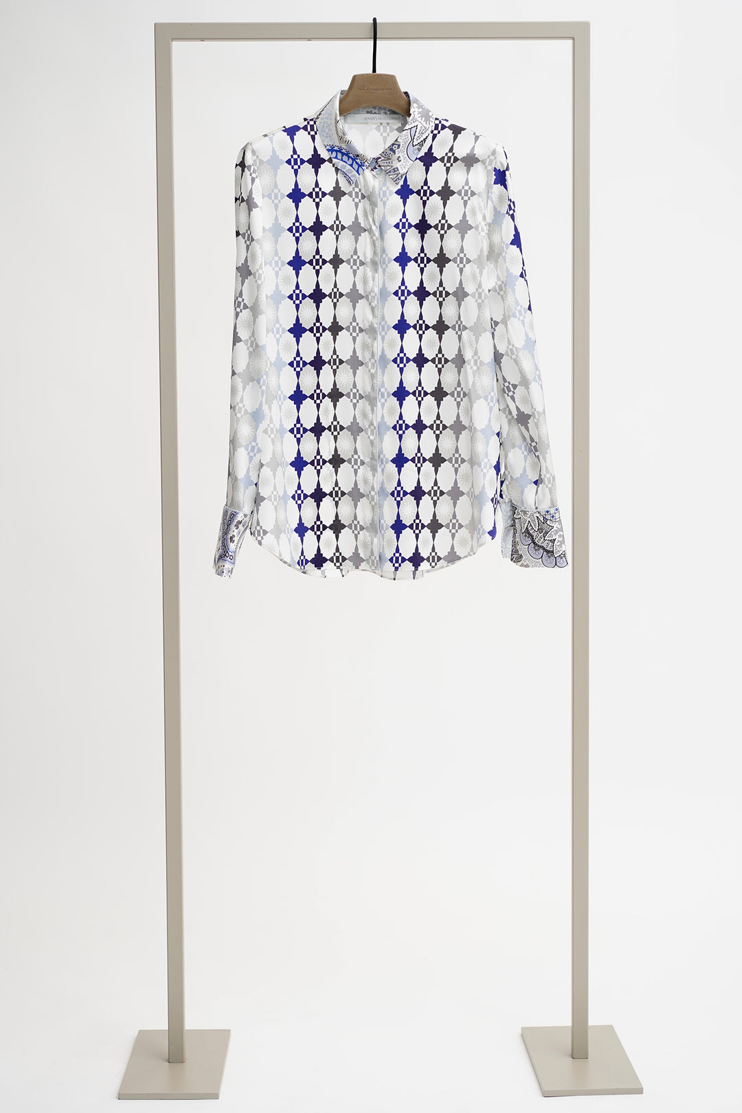 Patterned shirt on a mannequin against a white background
