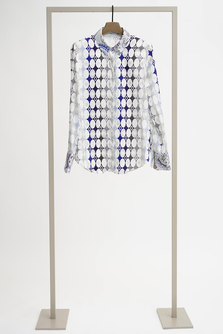 Patterned shirt on a mannequin against a white background