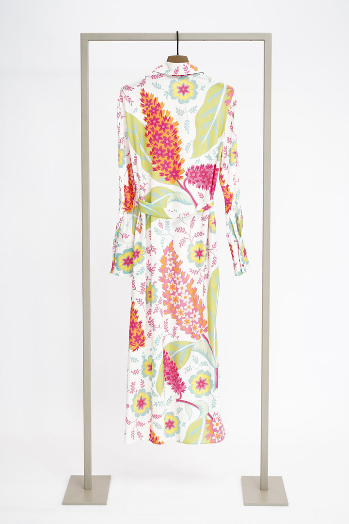Colorful floral dress on a clothes hanger against a white background to show back of dress