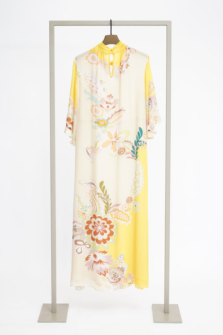 Floral print dress on a hanger against a white background to show back of dress