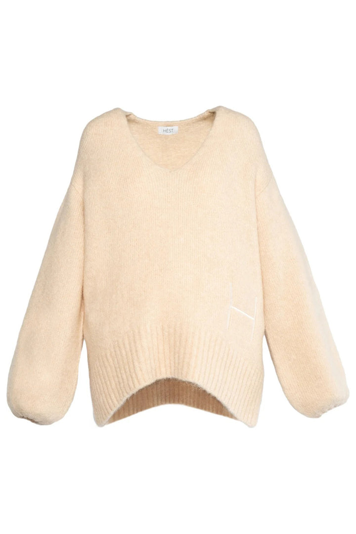 Beige sweater on a white background