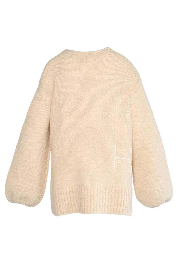 Beige sweater on a white background