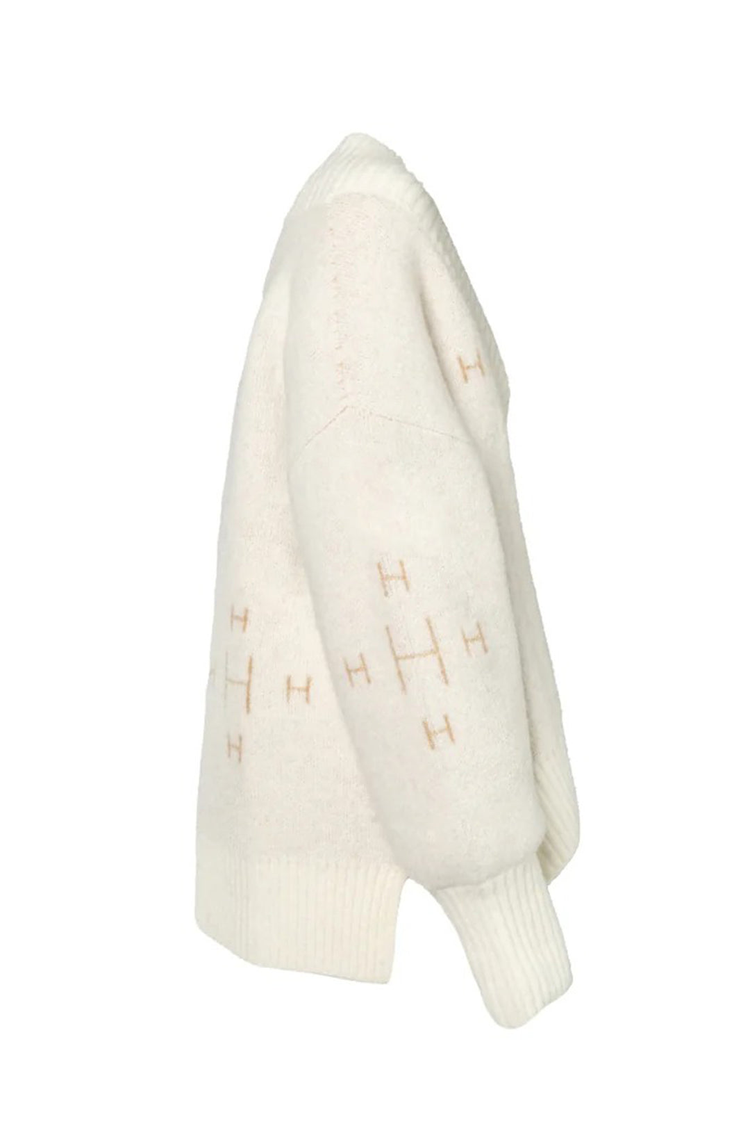 White sweater with gold patterns on a white background