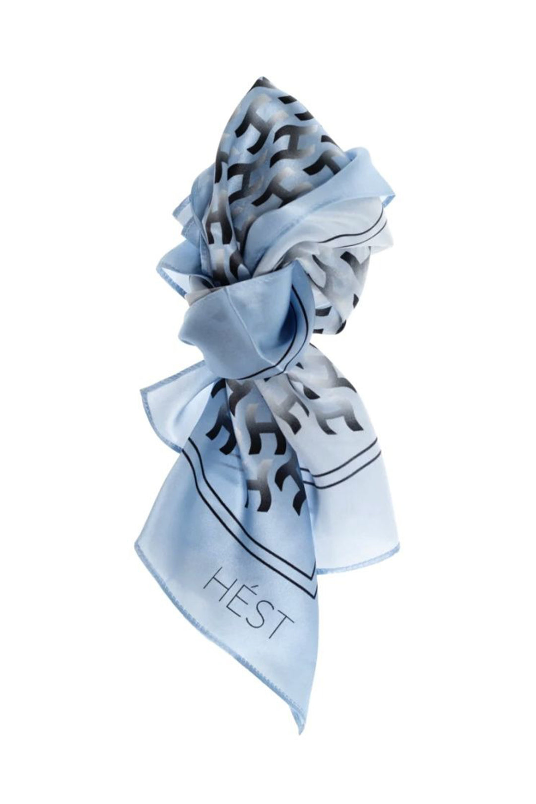 Light blue scarf with black patterns and 'Hést' branding on a white background