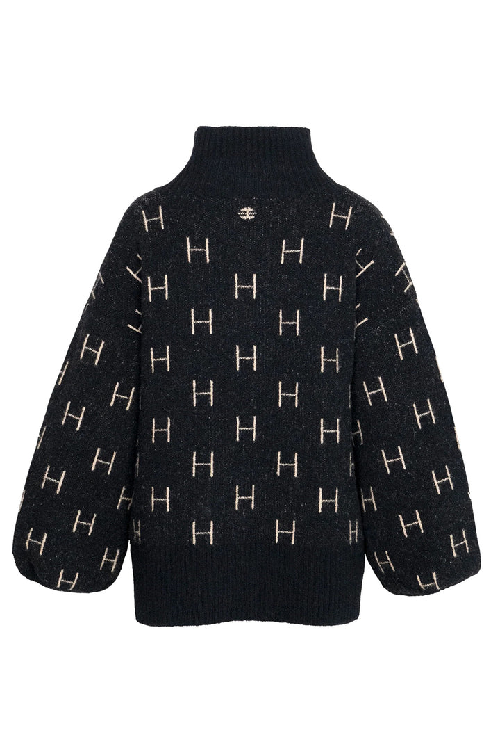 Black sweater with gold 'H' pattern on a white background