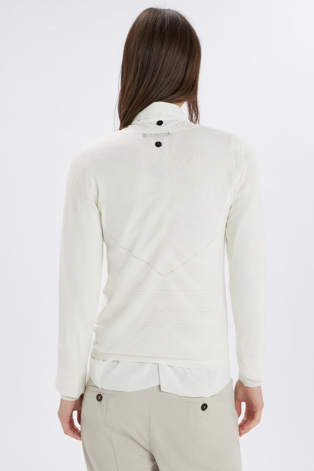 Woman wearing a white jacket on a white background