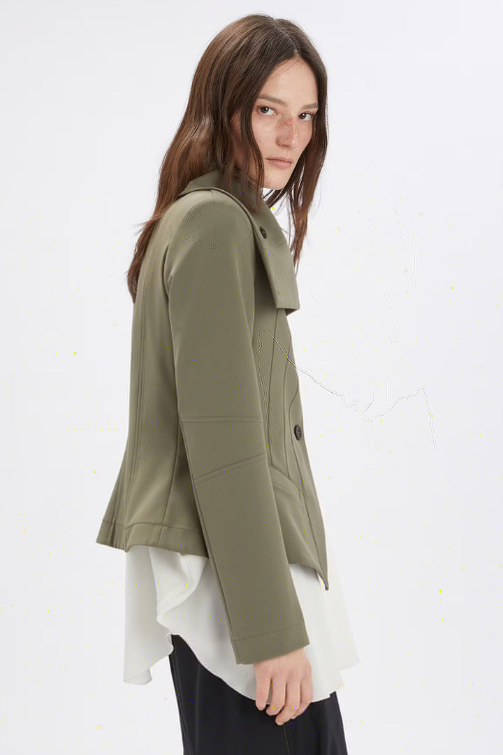 Woman wearing a green jacket on a white background