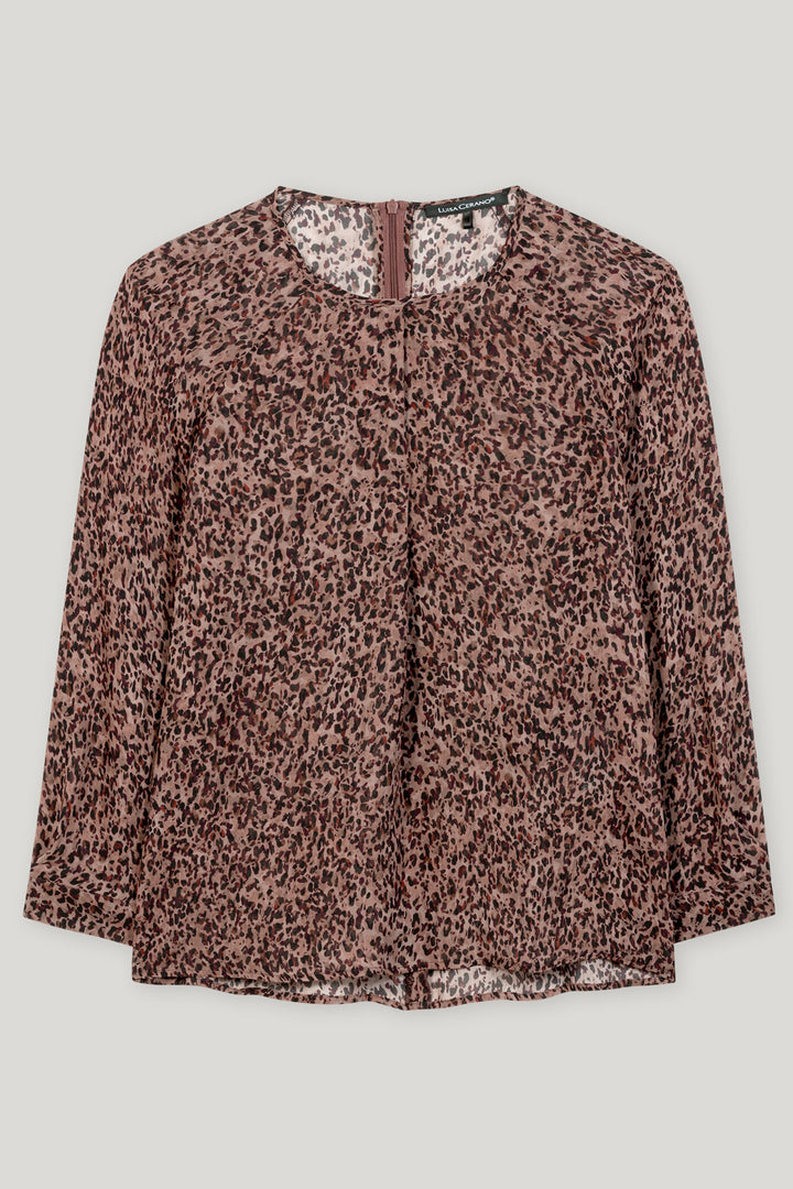 Leopard print blouse on a light gray background