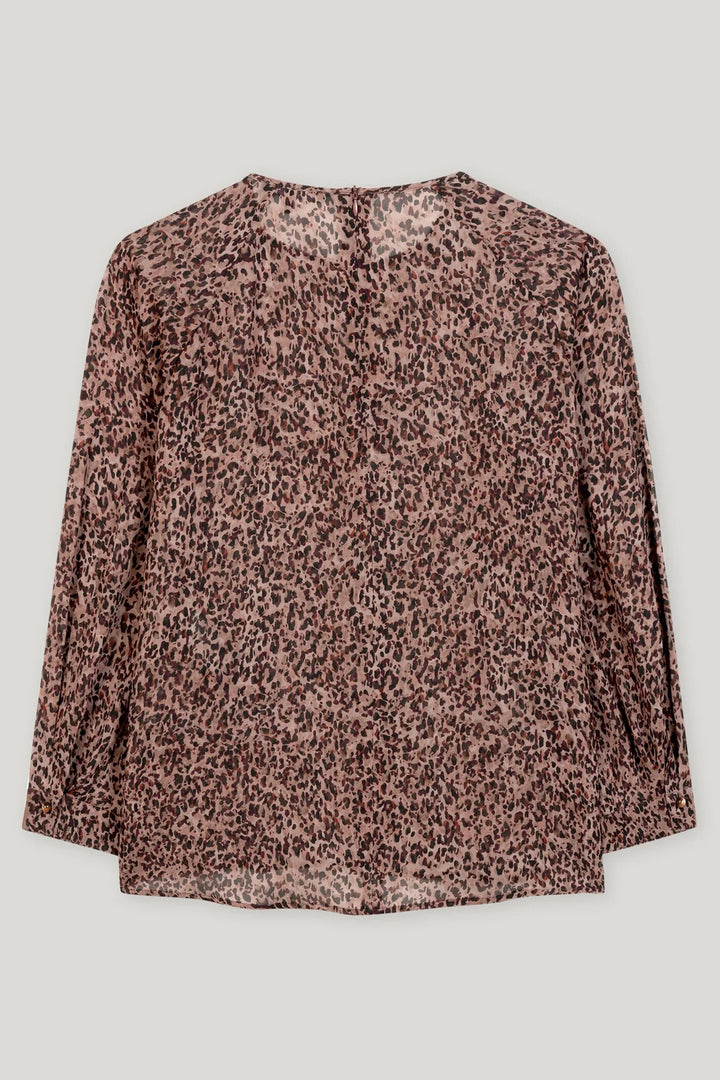 Leopard print blouse on a light gray background