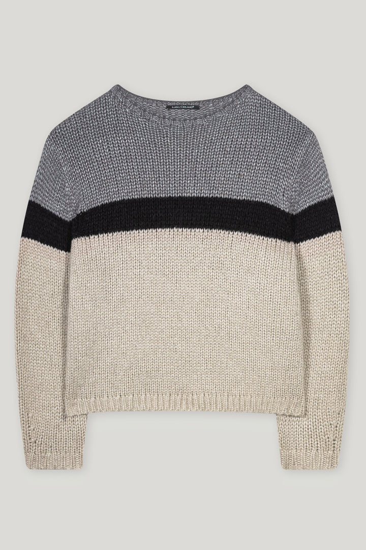 Knitted sweater with color-block design on a light gray background
