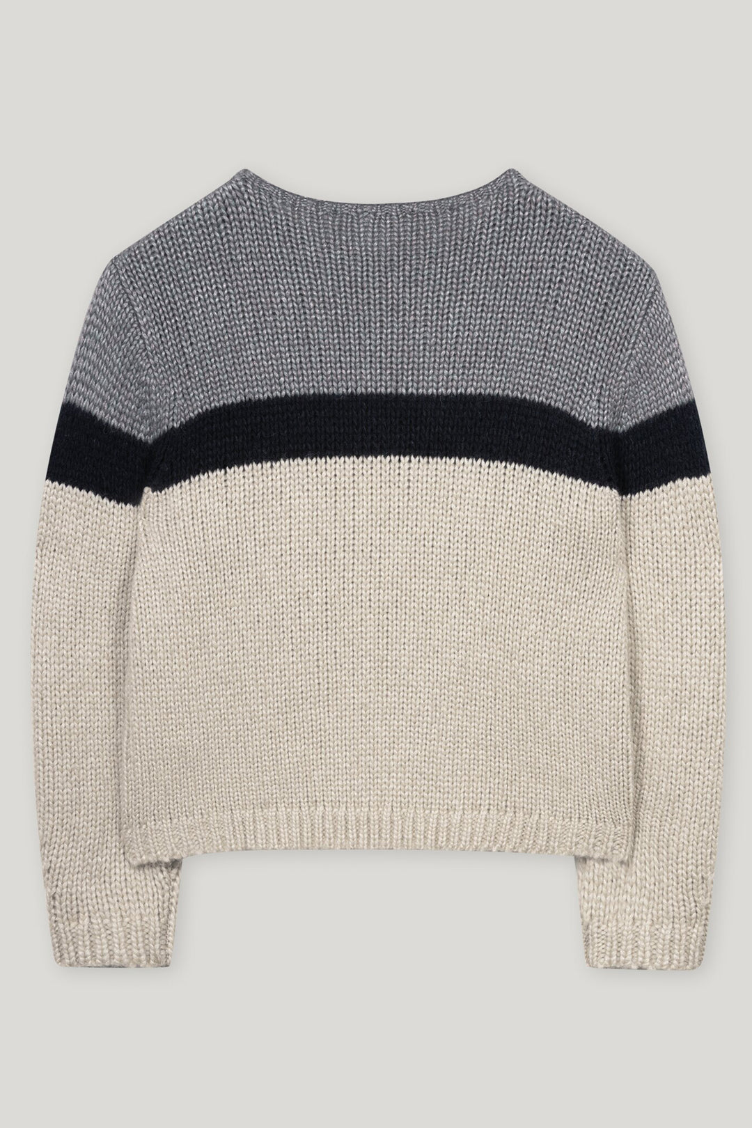Knitted sweater with color-block design on a light gray background