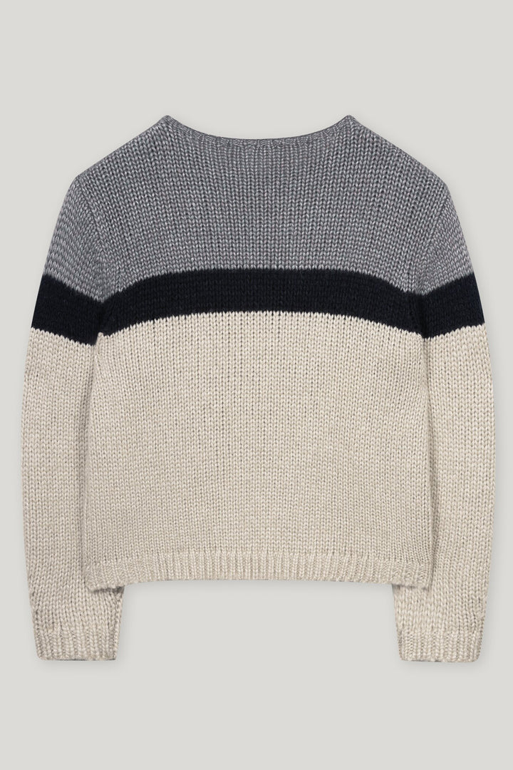 Knitted sweater with color-block design on a light gray background
