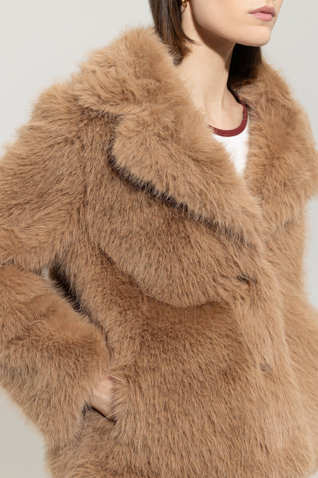 Close-up of a brown fur coat with a neutral background