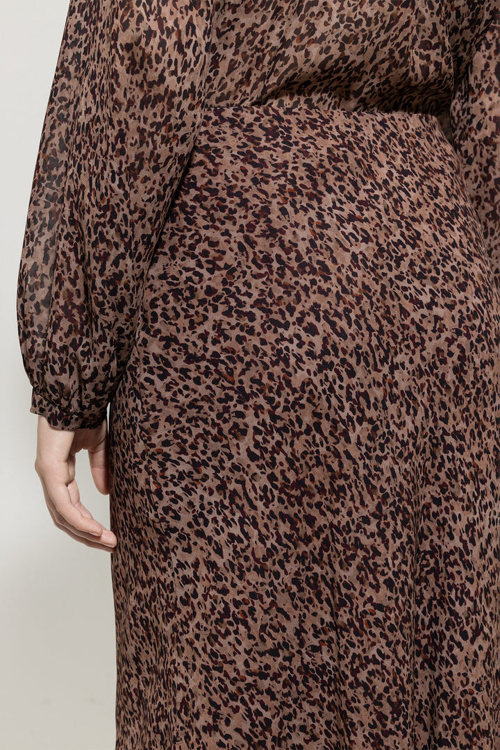 Leopard print dress on a plain background