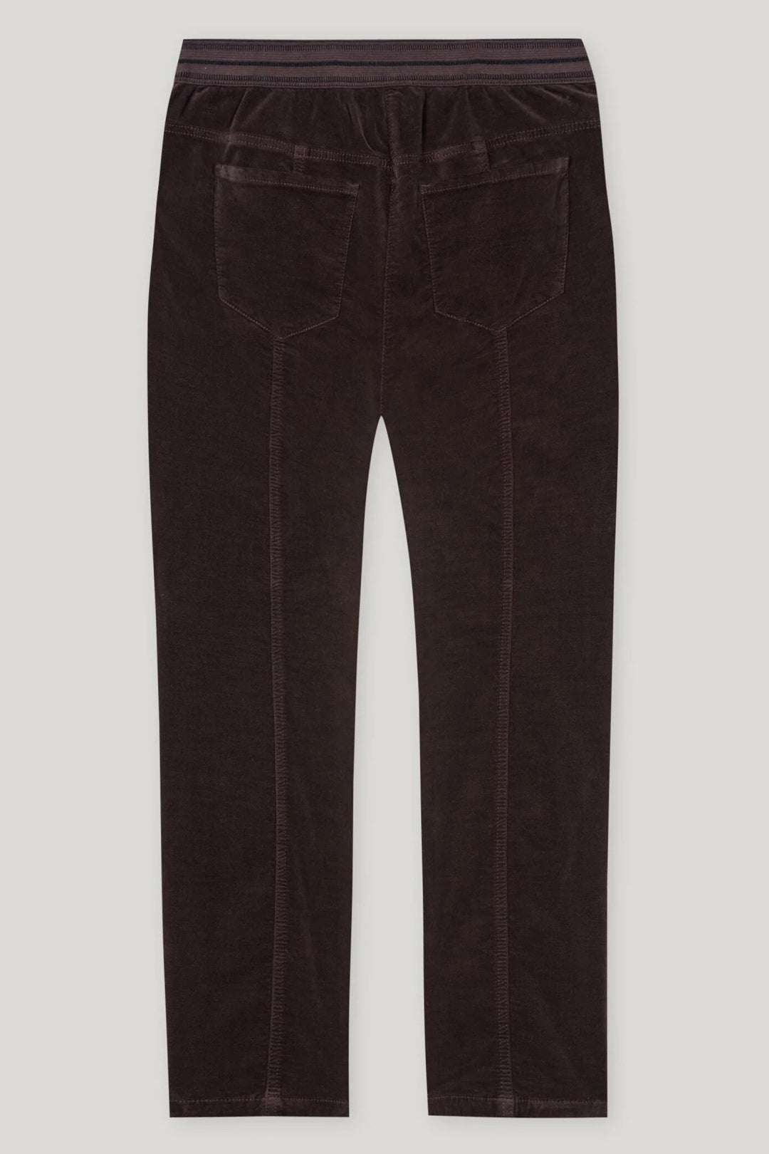 Dark brown velvet pants on a light gray background