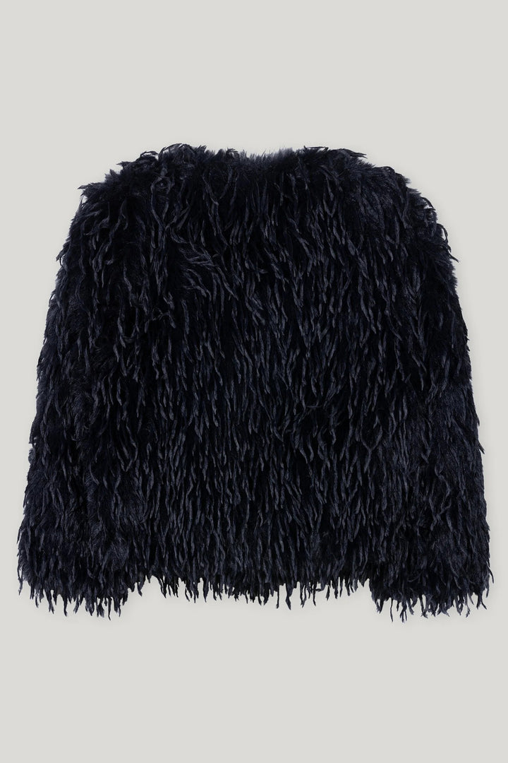 Navy fluffy jacket on a light gray background