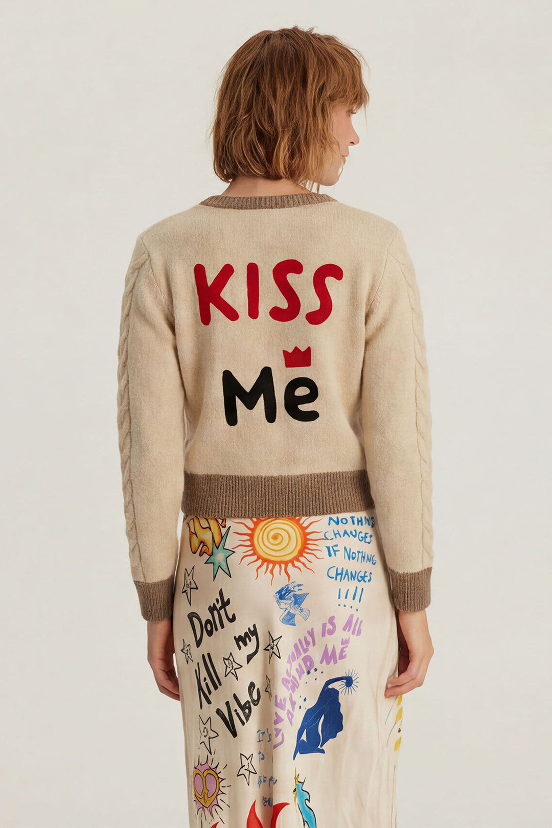 Me369 Sofi Stone Beige Cable Knit Cardigan 226S91283520, back view with Kiss Me lettering