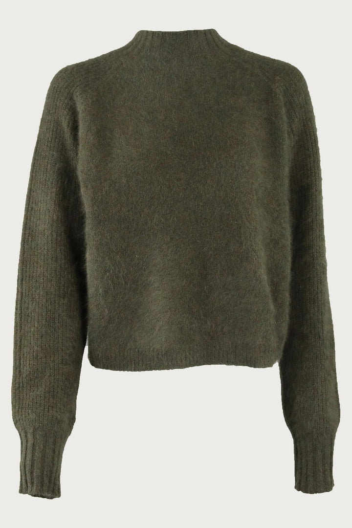 Green sweater on a white background