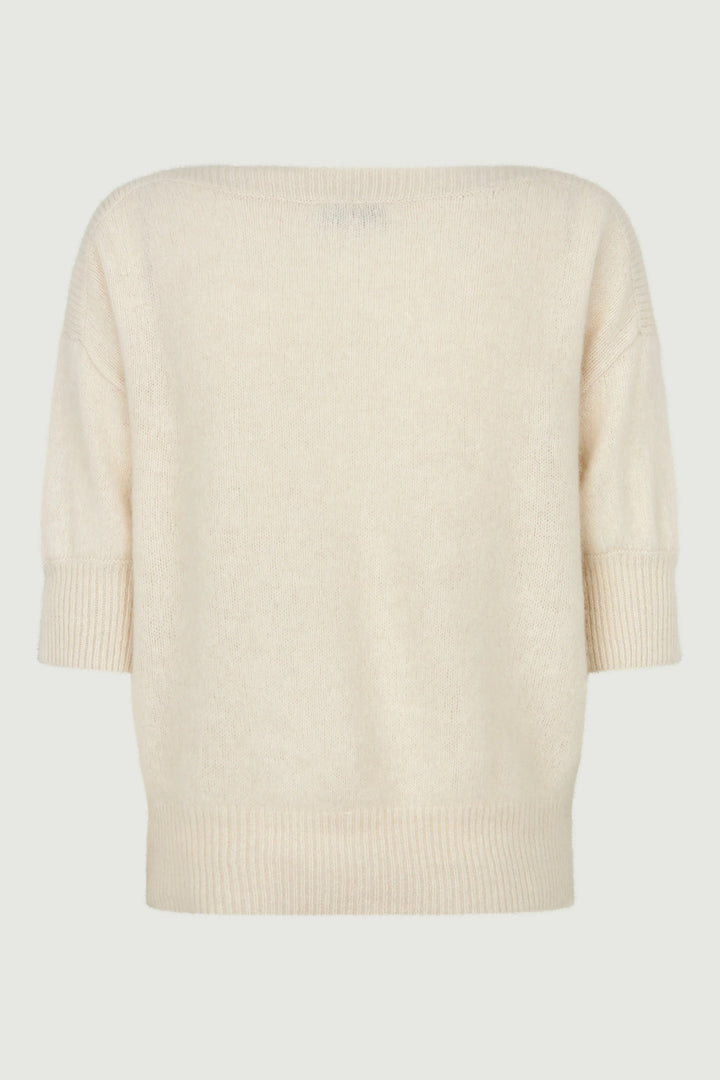 Beige sweater on a light gray background