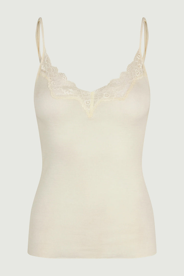 Beige camisole with lace details on a light gray background