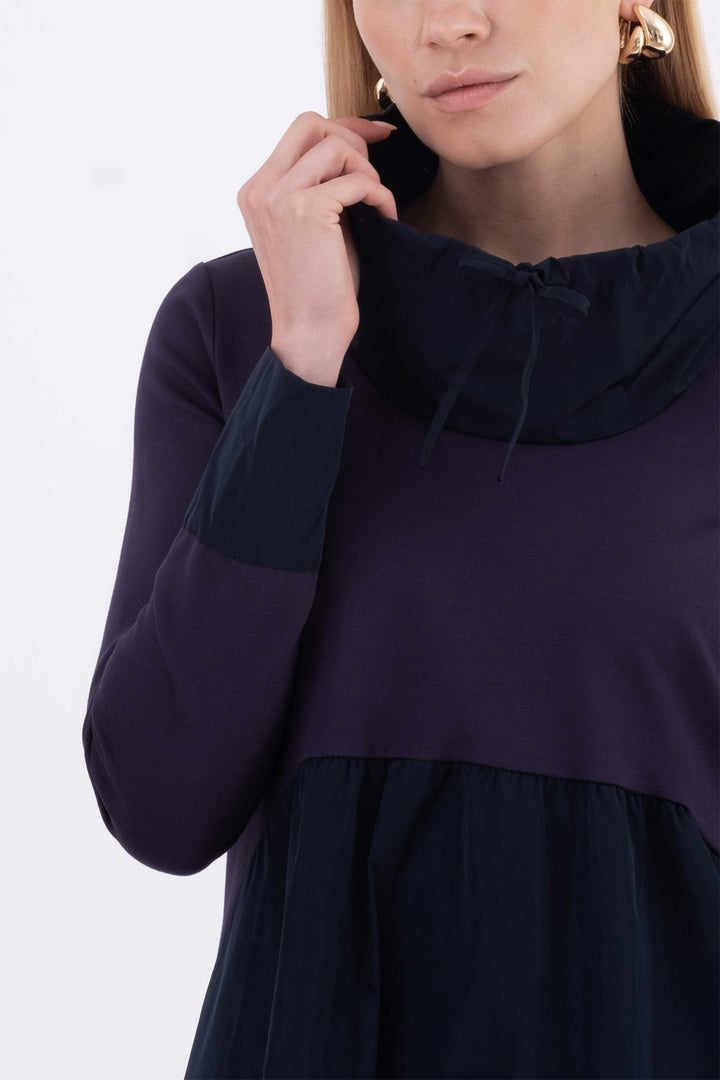 Navy blue dress with a high collar on a white background